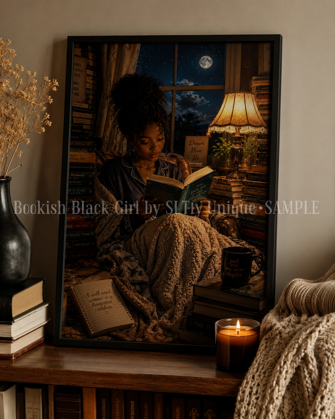 Lamplight Bookish Black Girl printable wall art in a black frame on a bookshelf with watermark